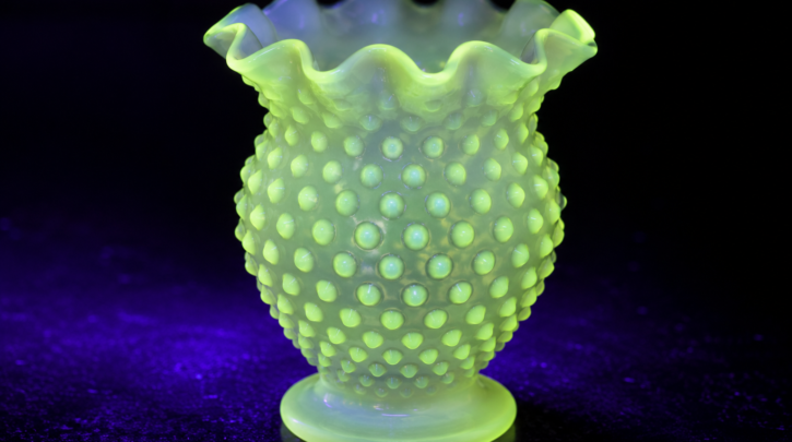 Illustration of milk glass showing a faint UV glow from manganese content